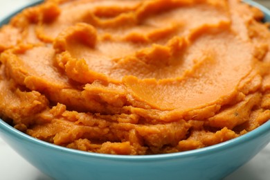 Tasty mashed sweet potato in bowl, closeup