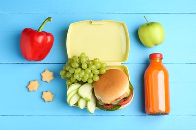 Photo of Plastic lunch box with burger, fresh fruits, bottle of juice, bell pepper and cookies on light blue wooden table, flat lay