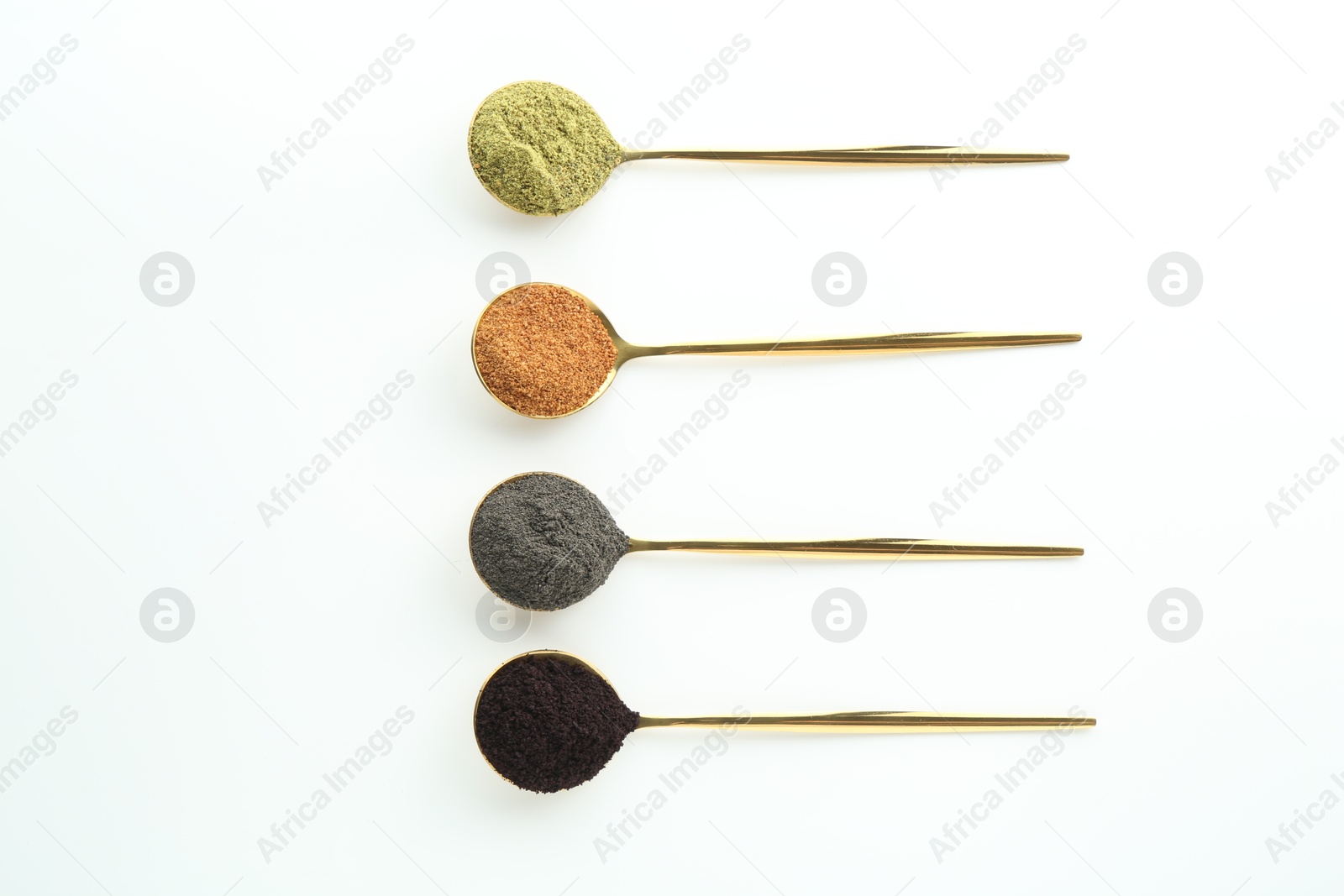 Photo of Spoons with different superfood powders on white background, flat lay