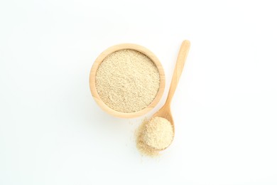 Photo of Superfood powder in bowl and spoon on white background, top view