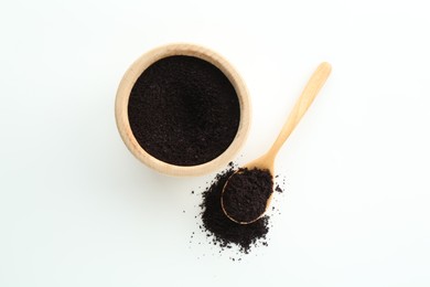 Photo of Superfood powder in bowl and spoon on white background, top view