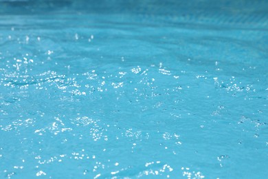 Clear water in outdoor swimming pool on sunny day