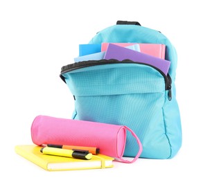 Photo of Backpack with different school stationery isolated on white