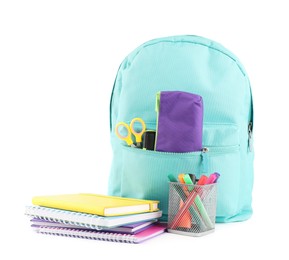 Photo of Backpack with different school stationery isolated on white