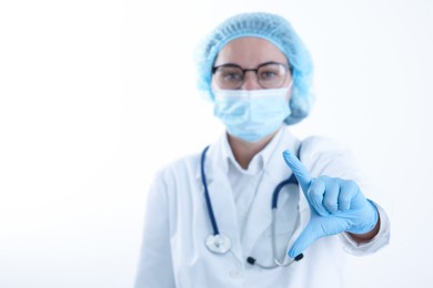 Photo of Doctor holding something on white background, selective focus