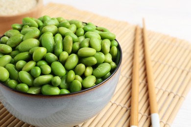 Fresh edamame soybeans in bowl on table, closeup