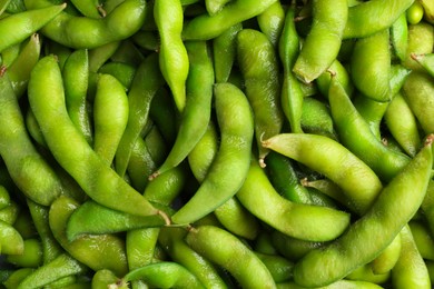 Photo of Fresh edamame pods as background, top view