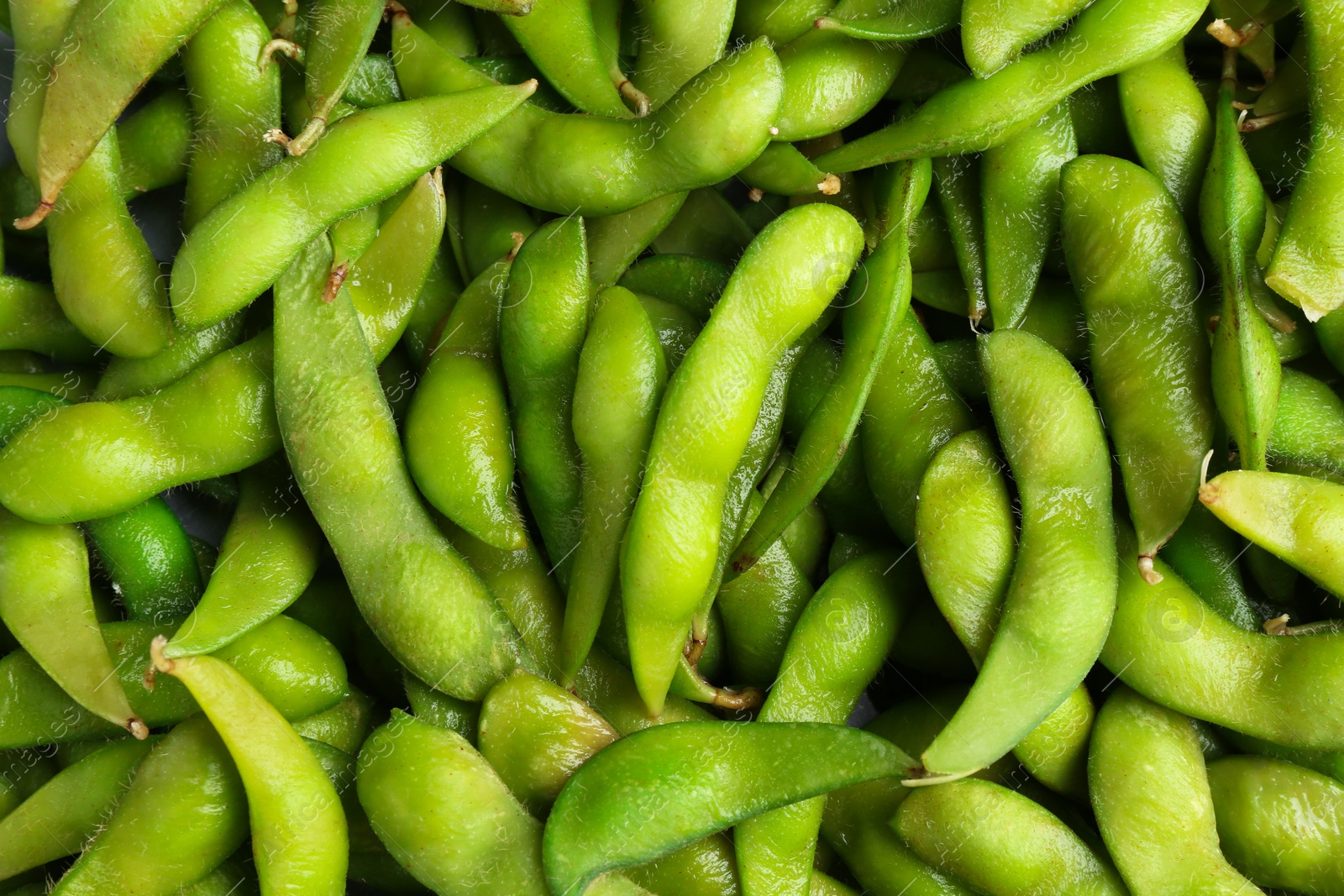 Photo of Fresh edamame pods as background, top view