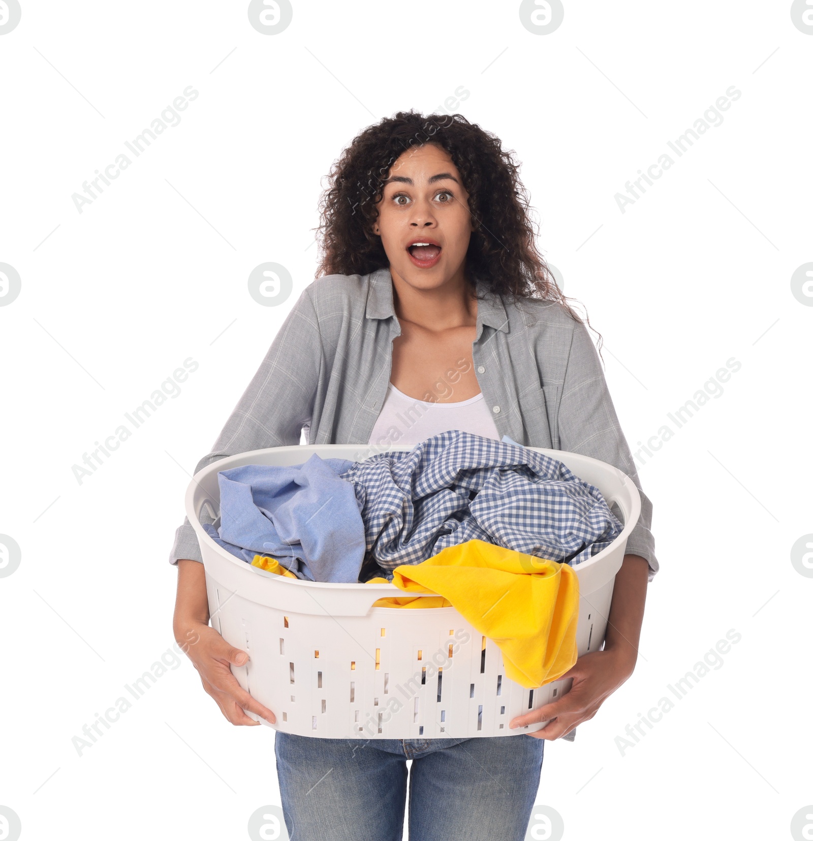 Photo of Shocked woman with basket full of laundry on white background