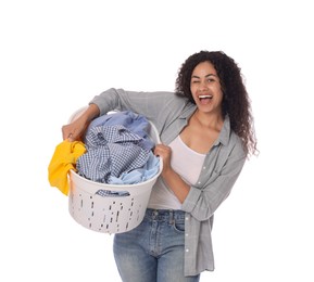 Photo of Happy woman with basket full of laundry on white background