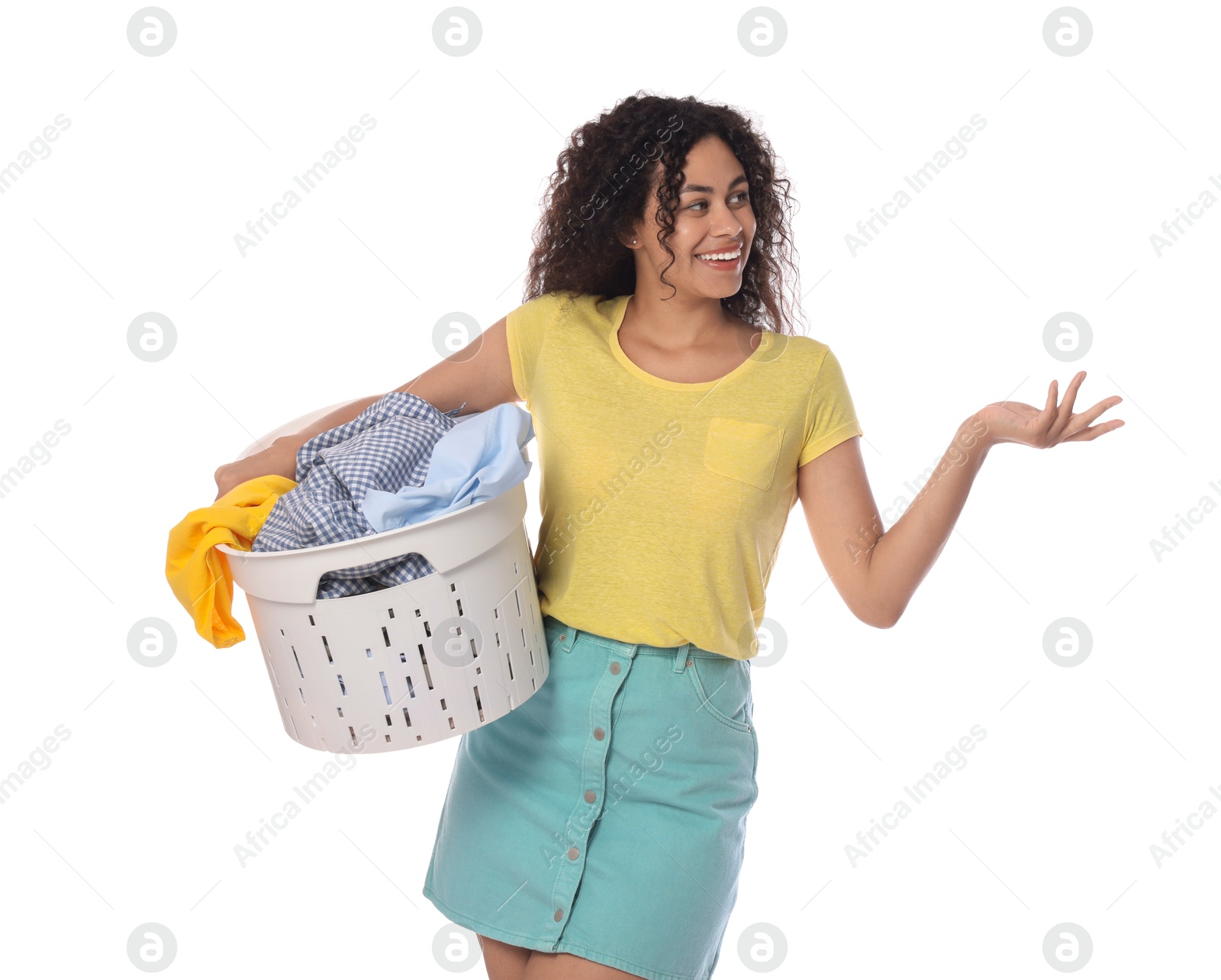 Photo of Happy woman with basket full of laundry on white background