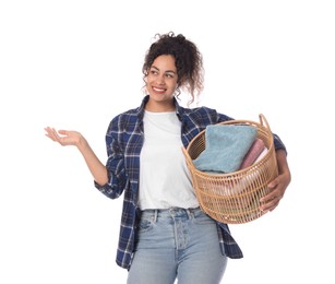 Photo of Happy woman with basket full of laundry on white background