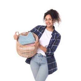 Photo of Happy woman with basket full of laundry on white background