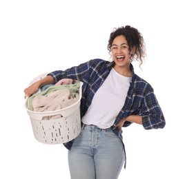 Photo of Happy woman with basket full of laundry on white background