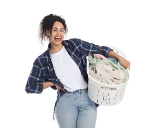 Photo of Happy woman with basket full of laundry on white background