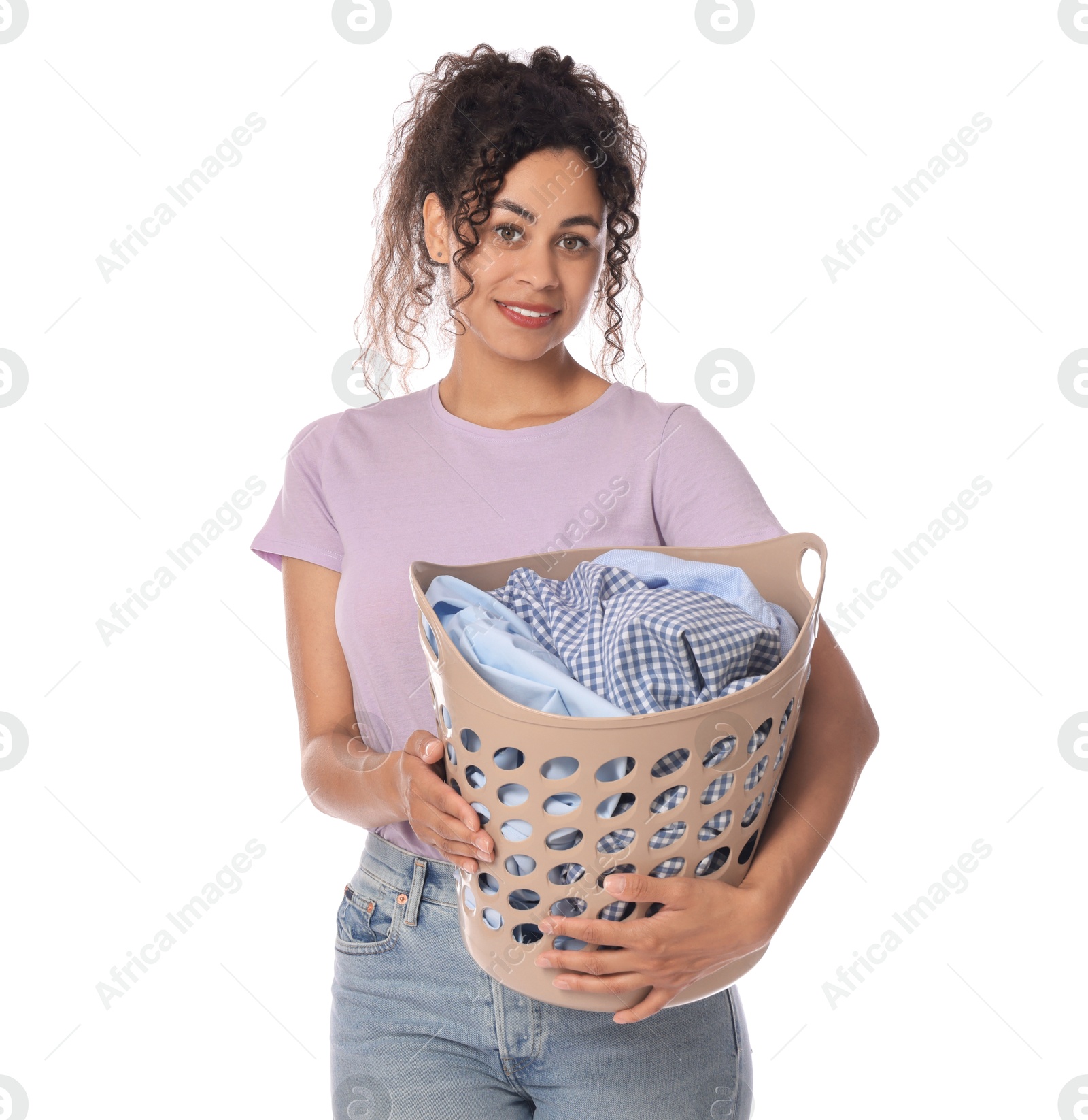 Photo of Happy woman with basket full of laundry on white background