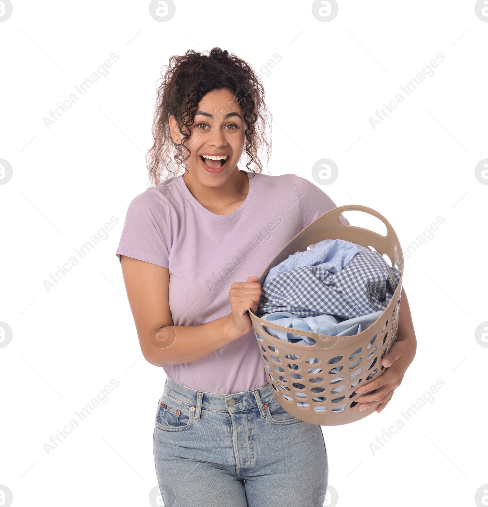 Photo of Happy woman with basket full of laundry on white background