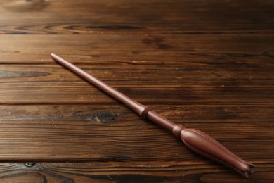 Photo of One old magic wand on wooden table