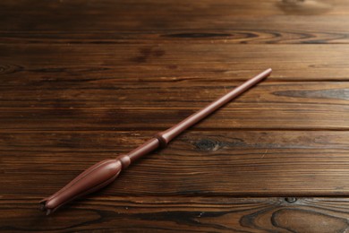 Photo of One old magic wand on wooden table