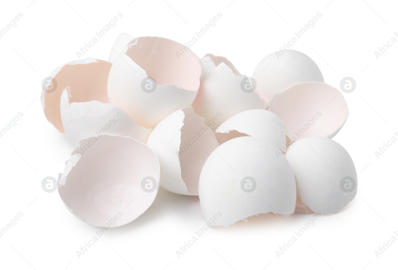 Photo of Pile of broken eggshells isolated on white