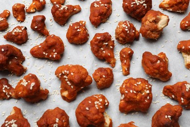 Photo of Tray with tasty cauliflower buffalo wings, top view