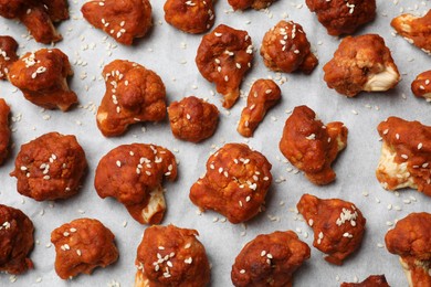 Photo of Tray with tasty cauliflower buffalo wings, top view