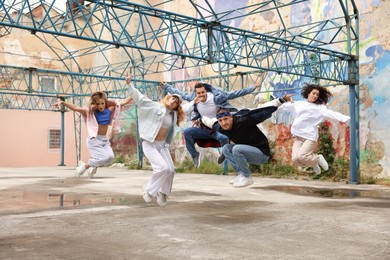 Image of Group of people dancing hip hop outdoors