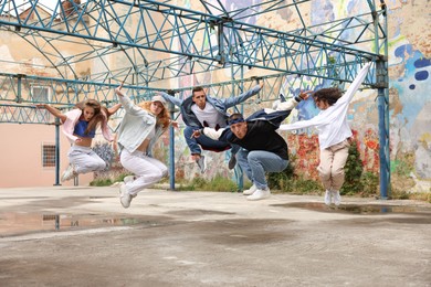 Group of people dancing hip hop outdoors