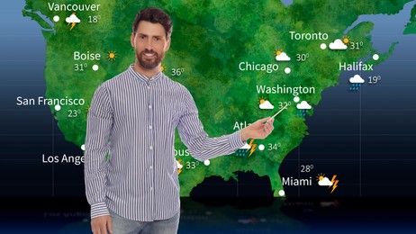 Weather broadcaster presenting forecast against map of USA