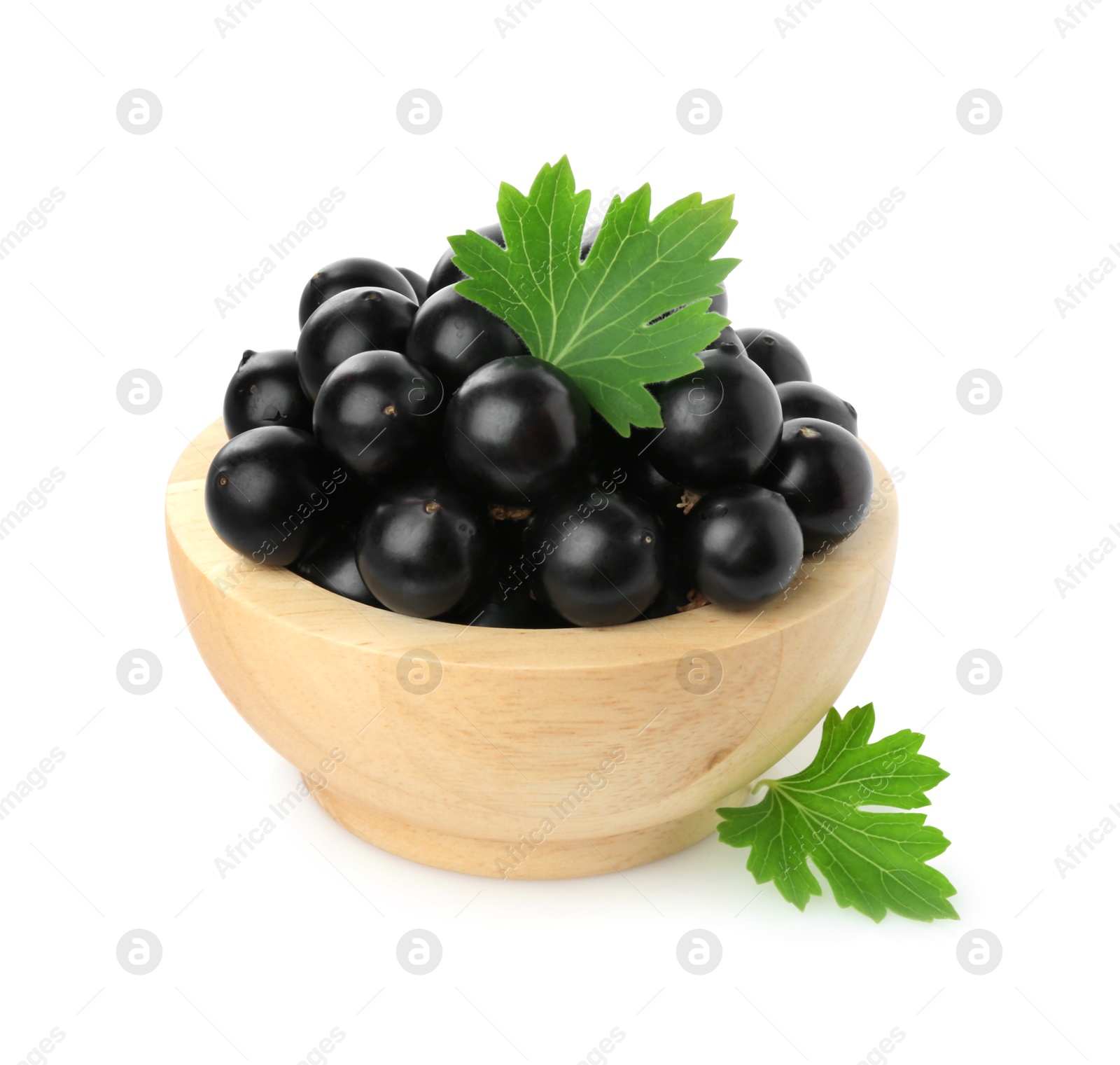 Photo of Fresh ripe black currant berries with leaves isolated on white