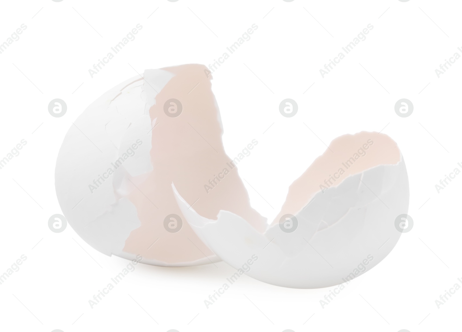 Photo of Pieces of broken eggshells isolated on white