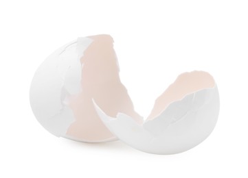 Photo of Pieces of broken eggshells isolated on white