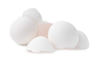 Photo of Pile of broken eggshells isolated on white