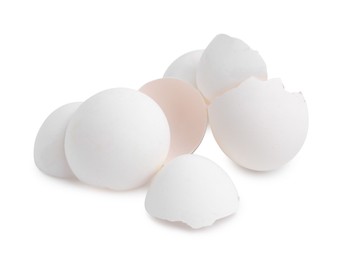 Photo of Pile of broken eggshells isolated on white