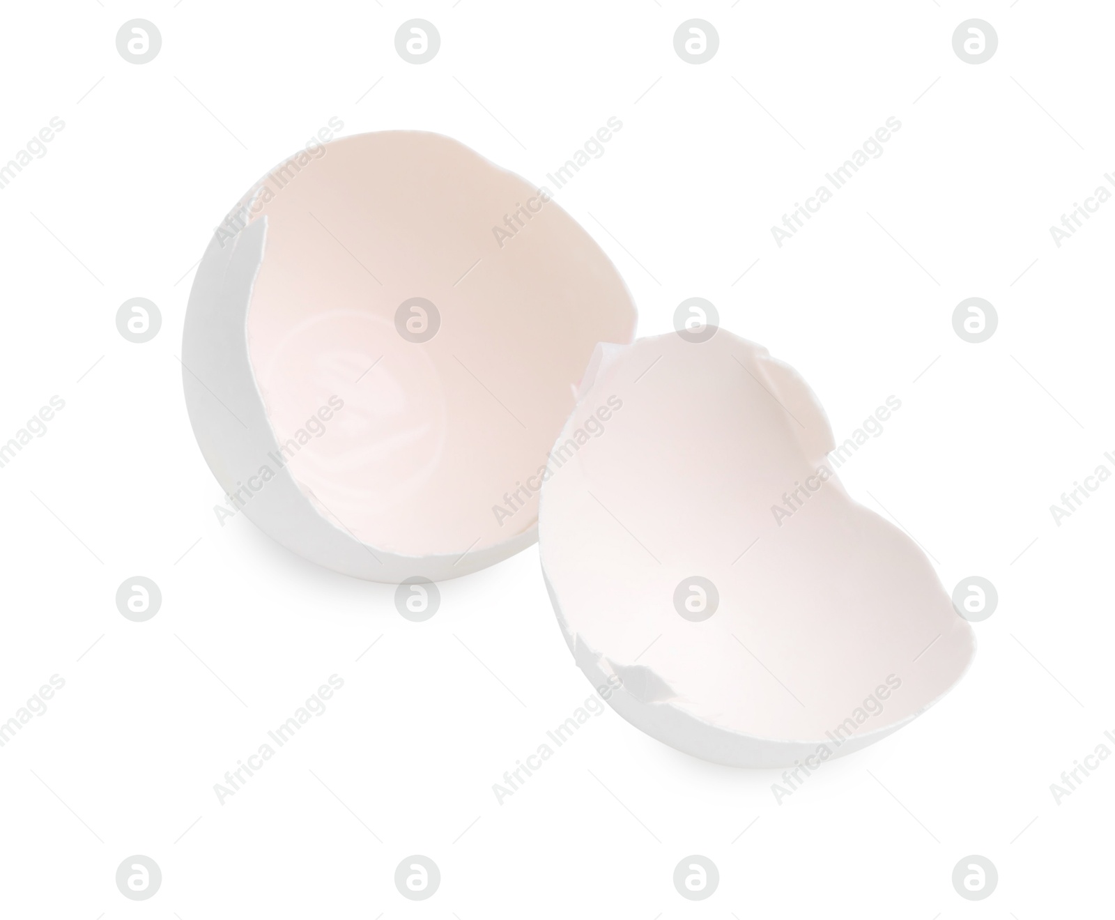 Photo of Pieces of broken eggshells isolated on white, above view