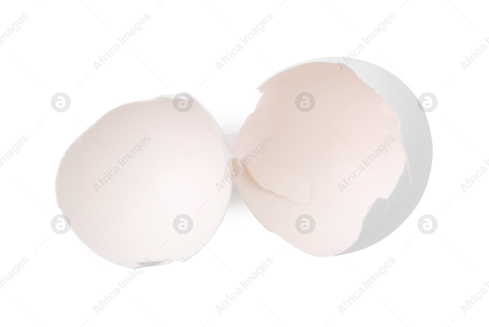 Photo of Pieces of broken eggshells isolated on white, top view