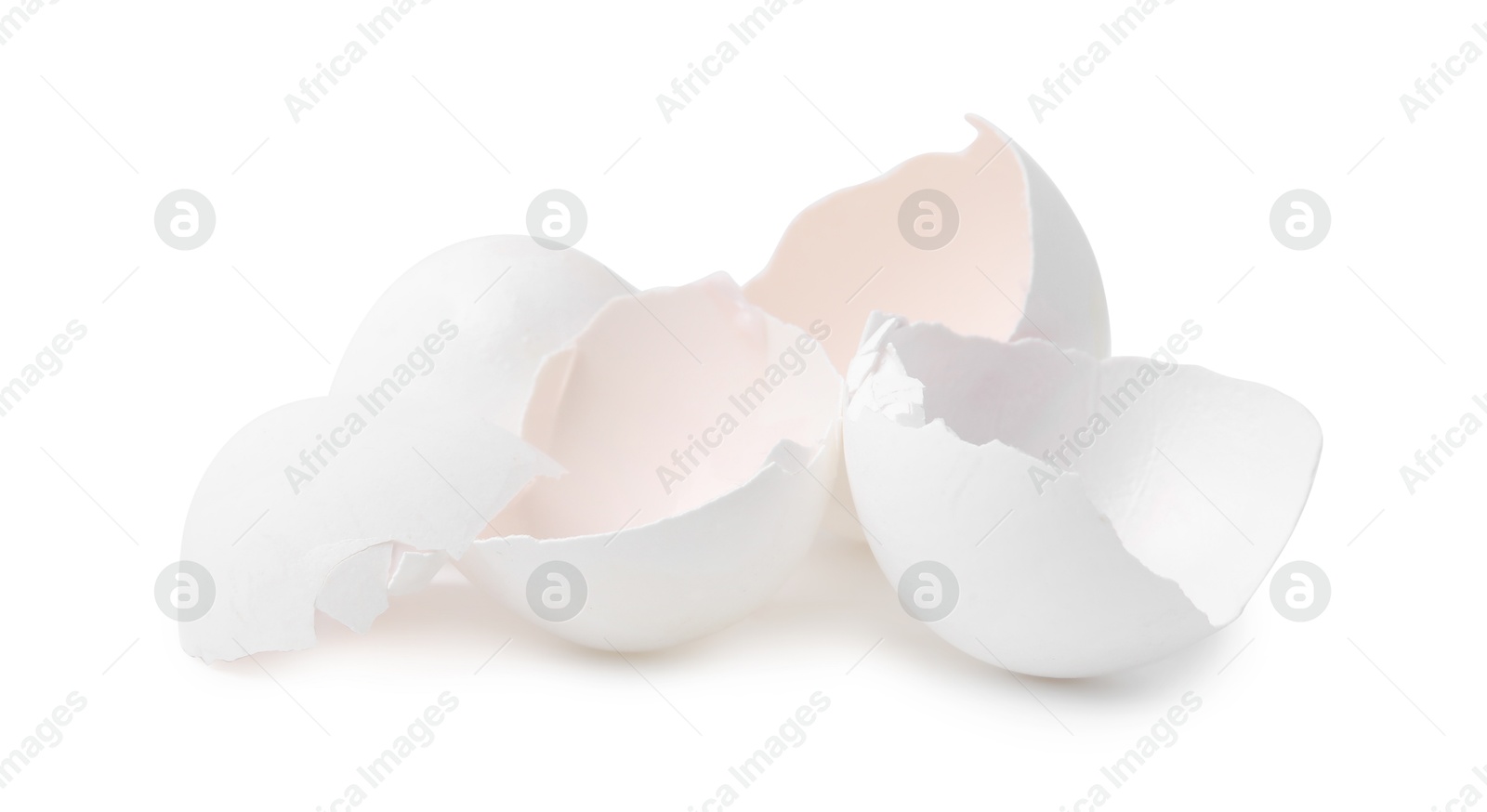 Photo of Pile of broken eggshells isolated on white