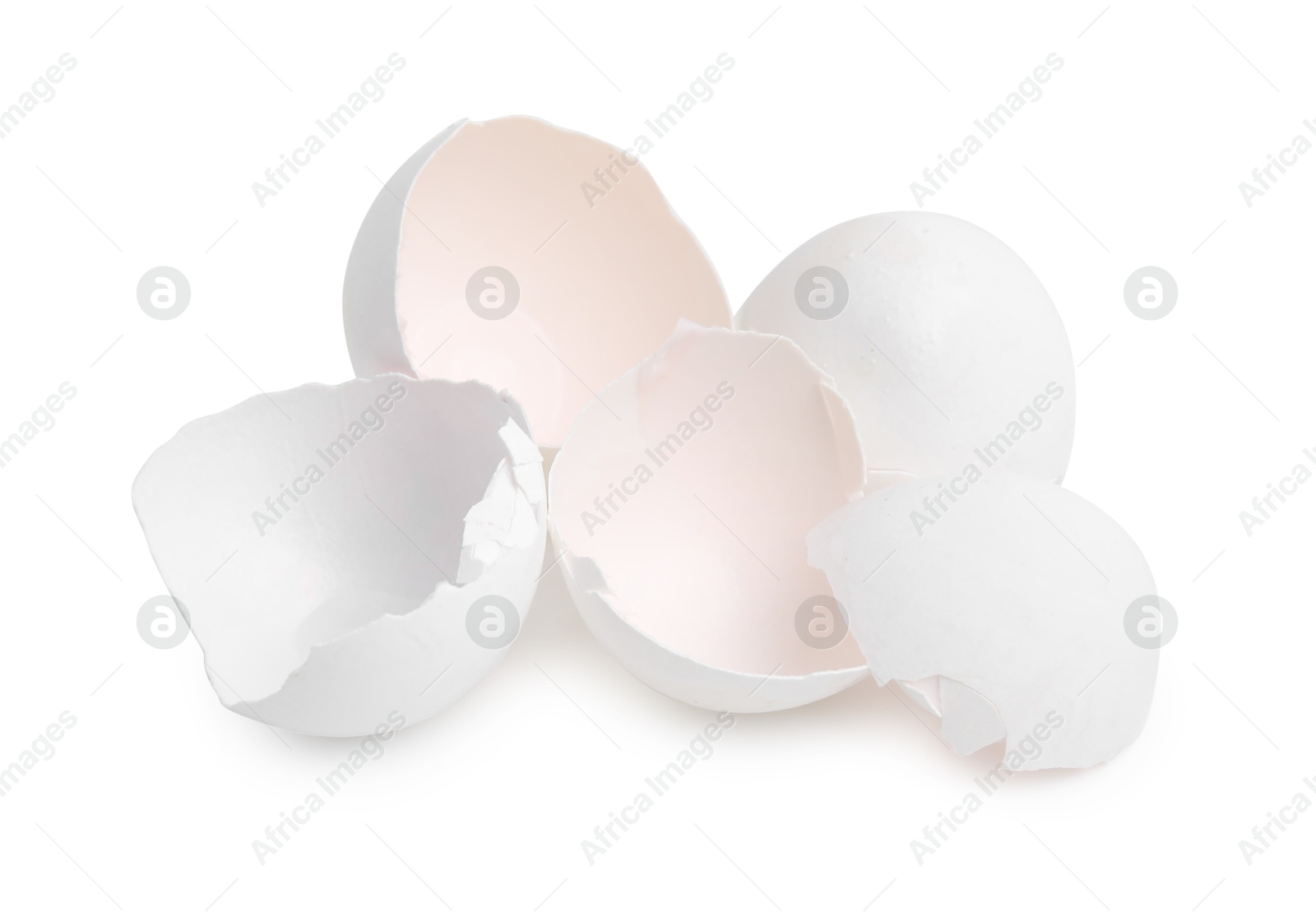 Photo of Pile of broken eggshells isolated on white