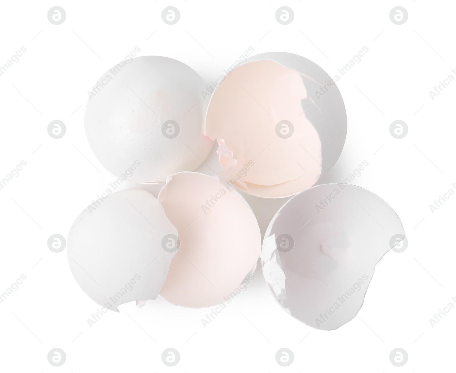 Photo of Pile of broken eggshells isolated on white, top view