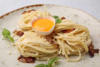 Photo of Delicious pasta Carbonara on grey table, closeup