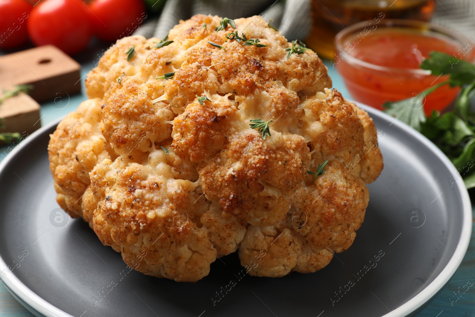 Photo of Delicious baked cauliflower and on table, closeup