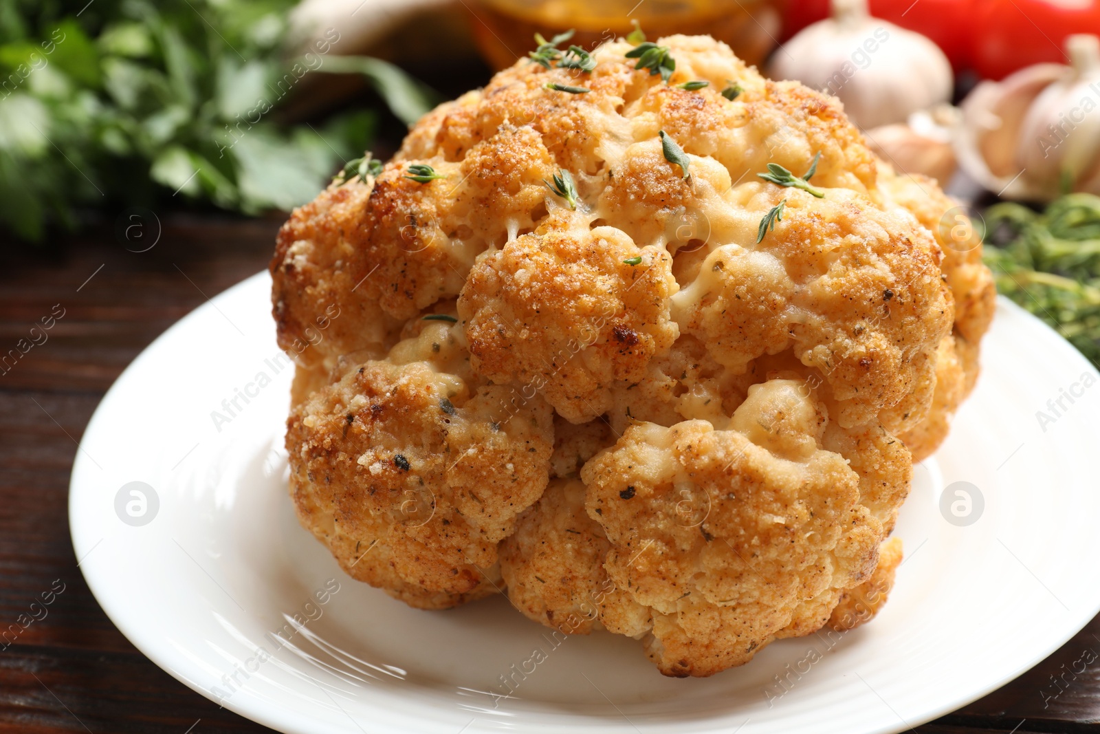 Photo of Delicious baked cauliflower with thyme on table, closeup