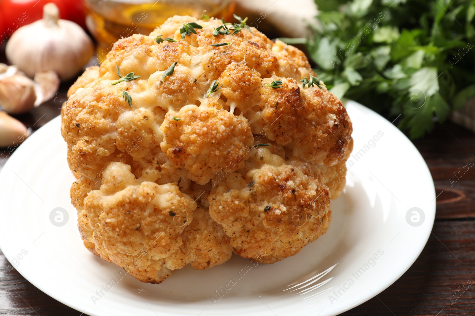 Photo of Delicious baked cauliflower with thyme on table, closeup