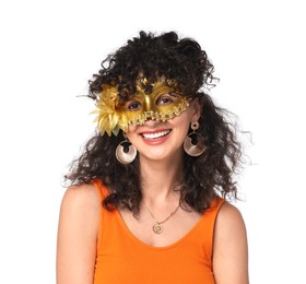 Smiling young woman wearing carnival mask on white background