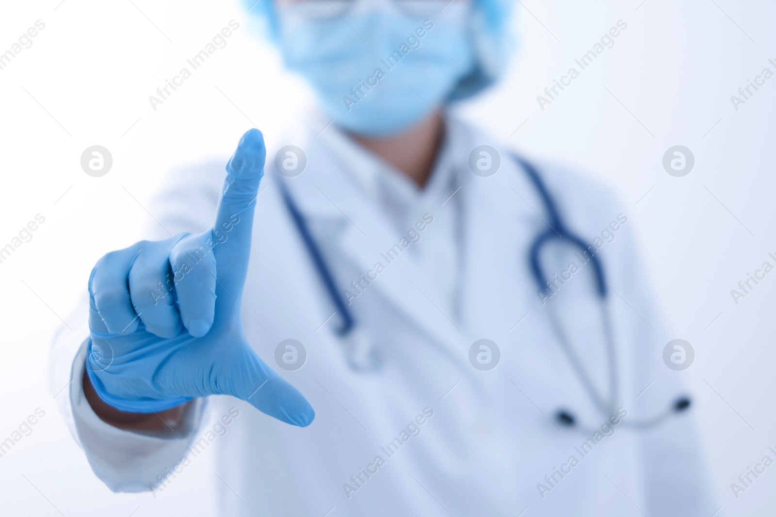 Photo of Doctor holding something on white background, closeup