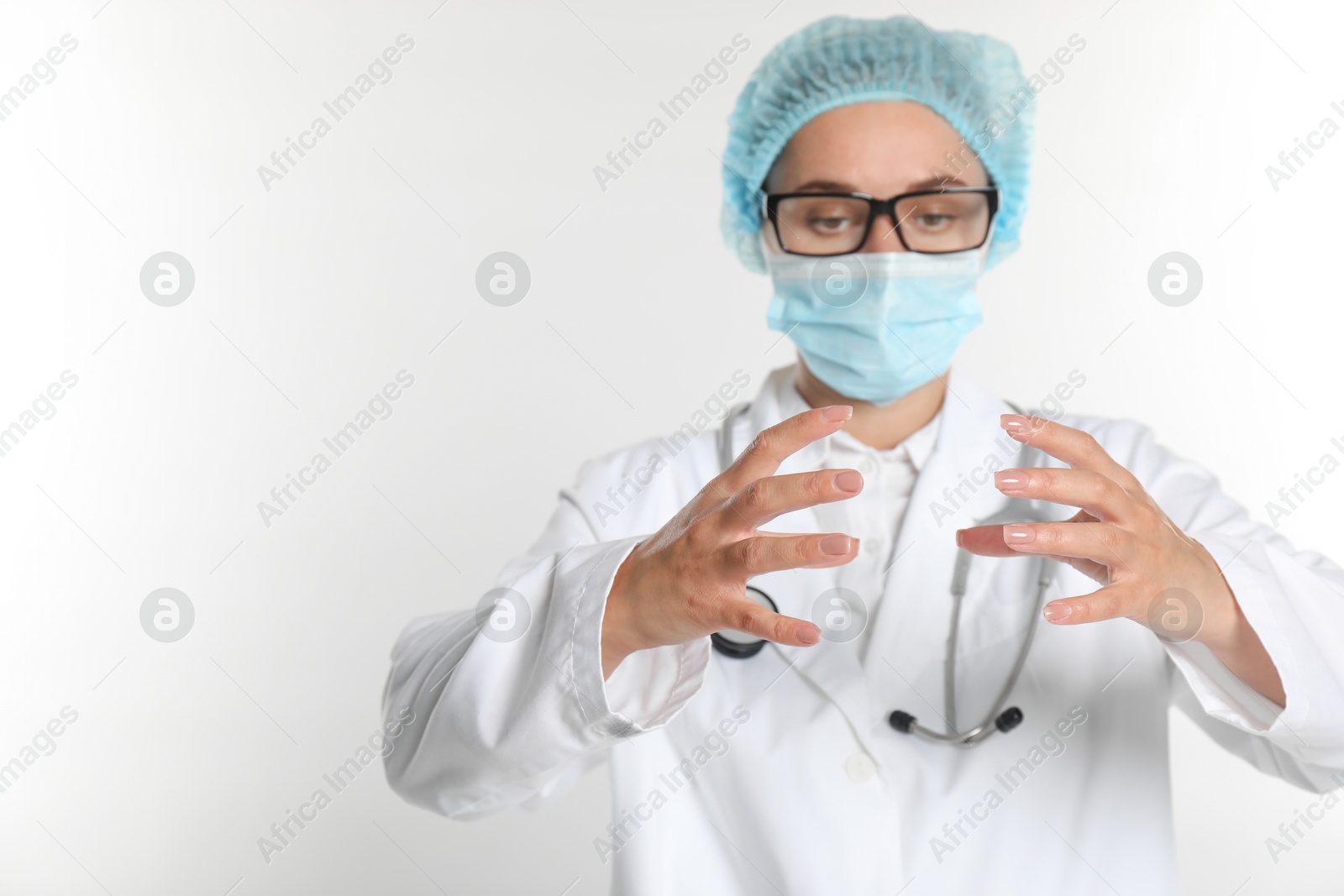 Photo of Doctor holding something on white background, selective focus