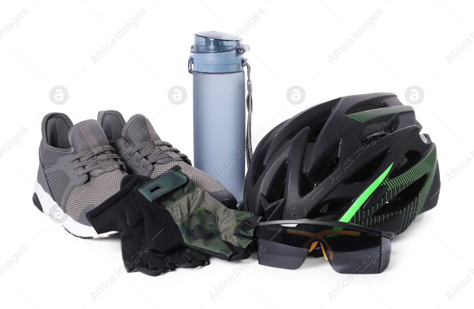 Photo of Bicycle helmet, sneakers, thermo bottle, goggles and fingerless gloves isolated on white