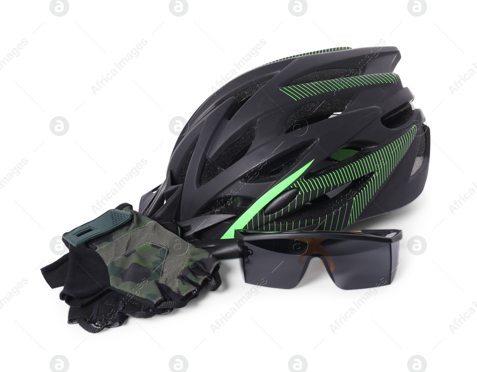 Photo of Bicycle helmet, goggles and fingerless gloves isolated on white