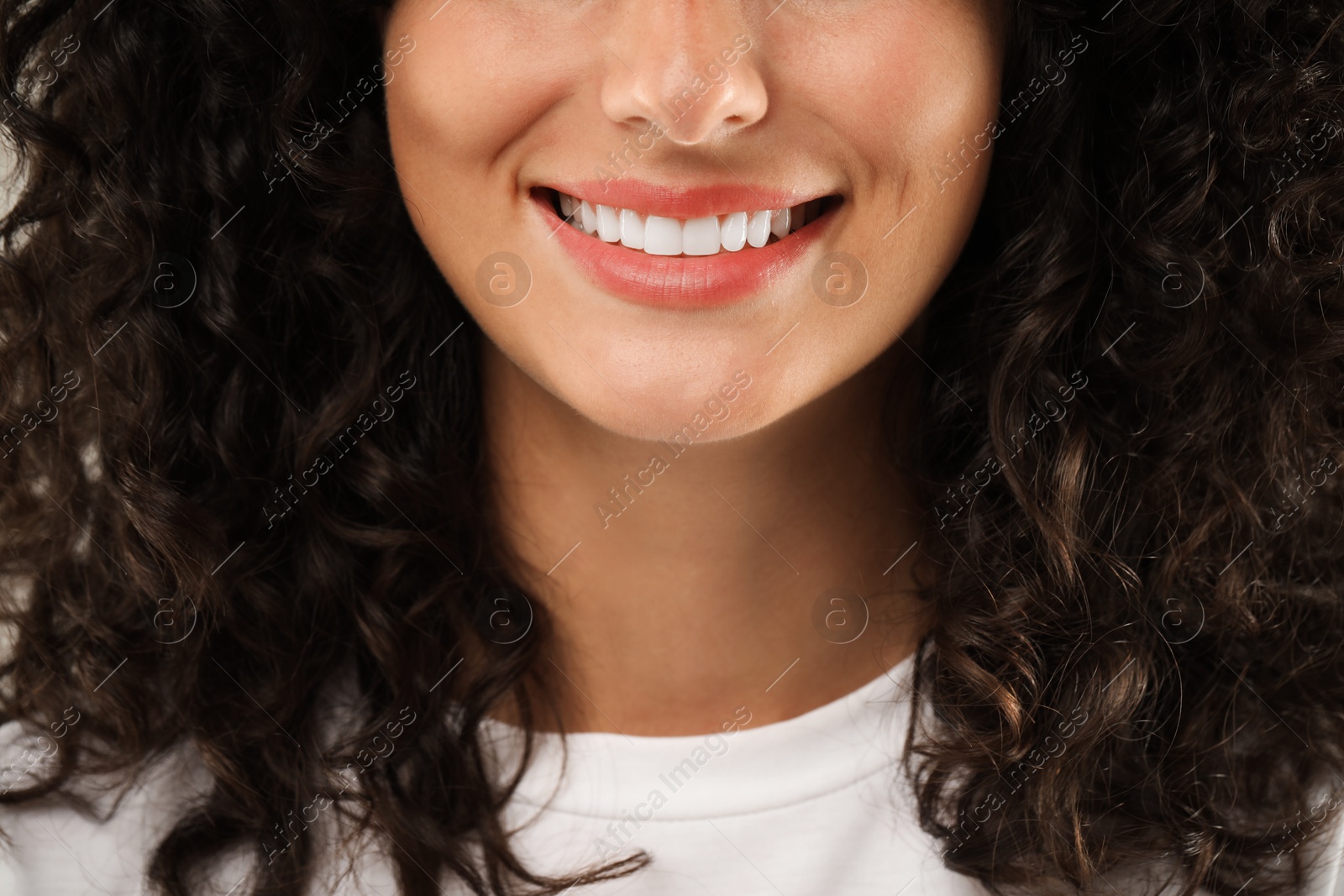 Photo of Closeup view of smiling woman. Dental veneers