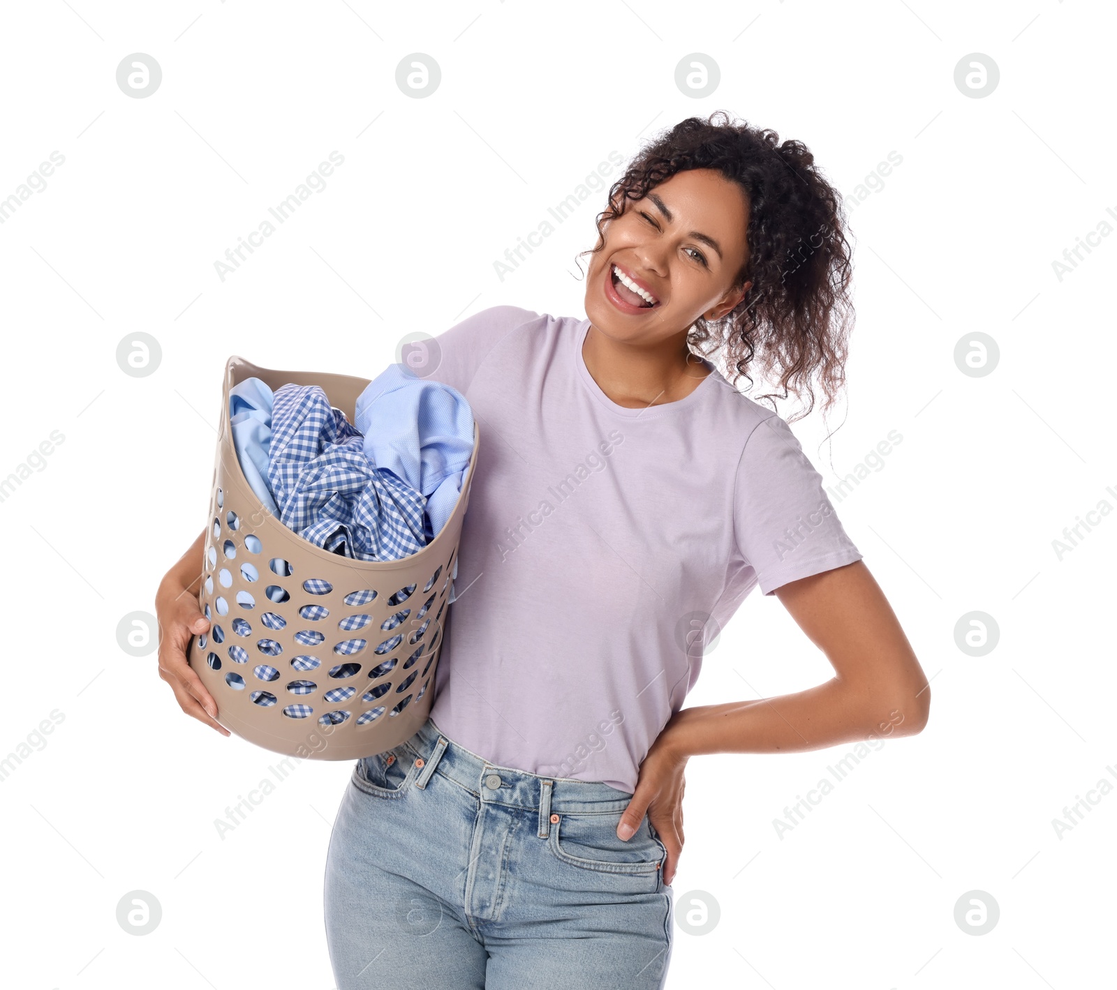 Photo of Happy woman with basket full of laundry on white background